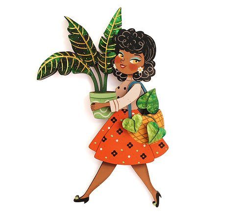 Broche chica con plantas